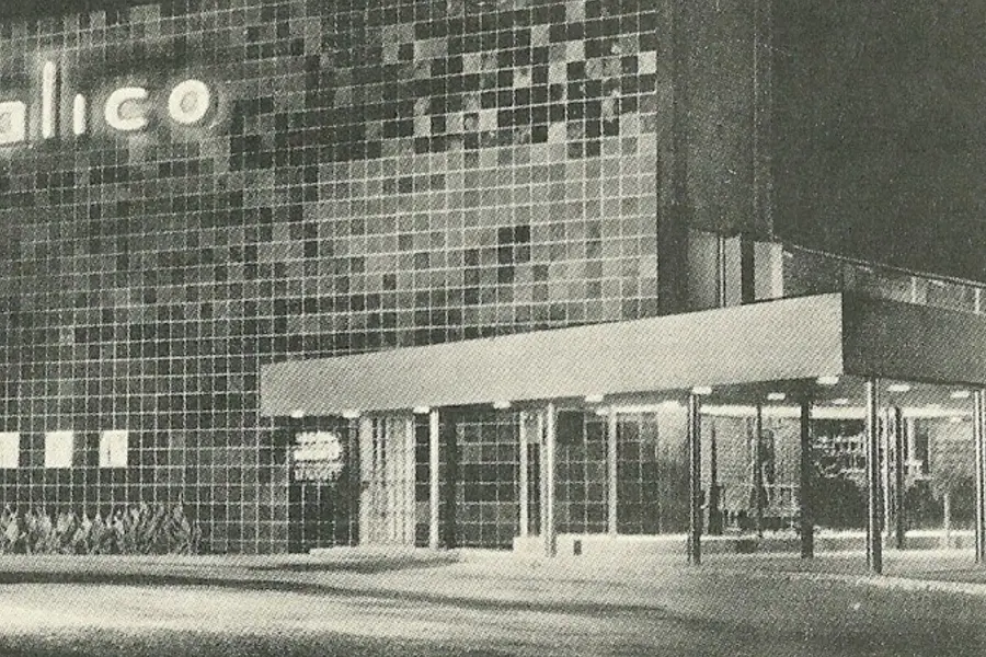 A black and white photograph of the museum's modernist concrete facade and lettering