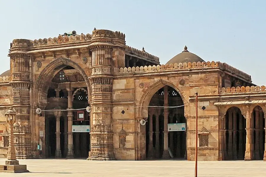 The pillared sandstone facade of Jama Masjid with its arched central entrance