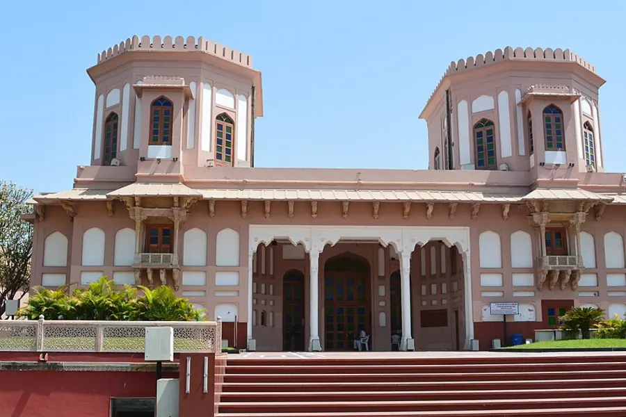 The pink twin-towered Moti Shahi Mahal with steps leading up to it