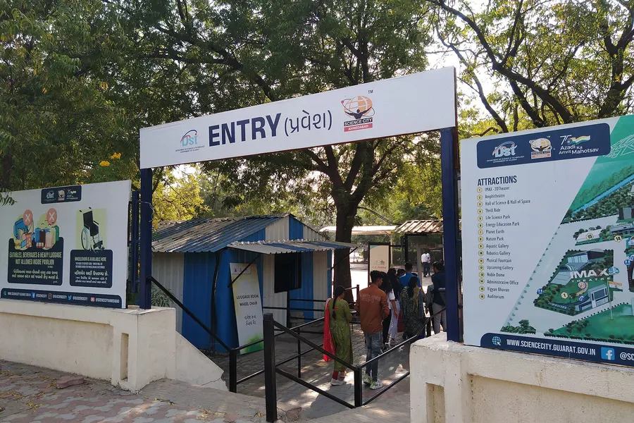 The Gujarat Science City entry gate with an attractions board beside it